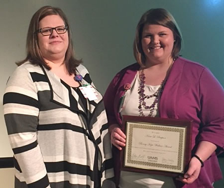 Kacie Simpson (right) received the Bonny Hope Wallace Award from Sandy Annis.