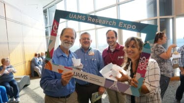After making the rounds at the Expo, researchers enjoyed ice cream. (l-r) Kirk Smith, Phillip Farmer, Michael Rutherford and Debra Napoli. 