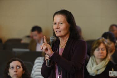 Linda Larson-Prior, Ph.D., asks a question during the conference.