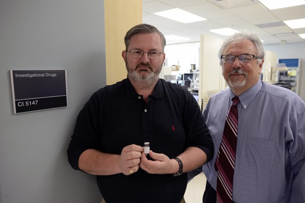 Larry Parker (left) in the UAMS Office of Research Regulatory Affairs, with Thomas Kieber-Emmons, Ph.D., in the UAMS Research Pharmacy. Parker has been a mainstay in the years-long effort to bring Kieber-Emmons’ breast cancer vaccine to clinical trial.