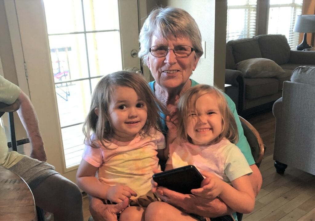 Cornelia Ann Smith of Calico Rock, Ark., here with two of her grandchildren, is pain free thanks to her participation in a UAMS study of an advance in spinal cord stimulation devices.
