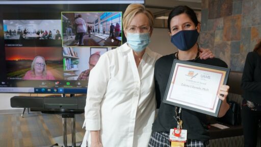 TRI Director Laura James, M.D., (left) with Zulema Udaondo, Ph.D., who won Best Representation of Informatics Supported Research.
