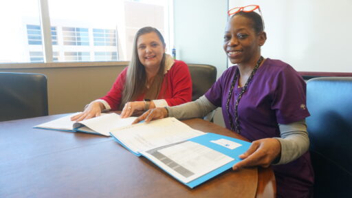 Deanne King, M.D., Ph.D., (left) meets with TRI’s Kennetha Newman, the study’s lead research coordinator.