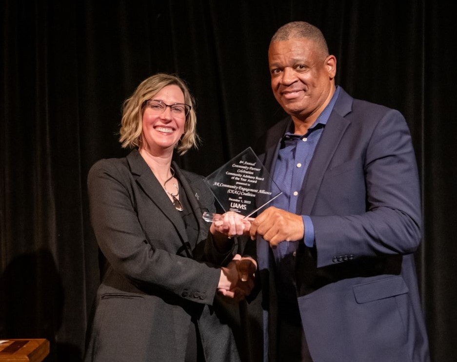 The Arkansas Community Engagement Alliance (CEAL) Coalition won the Community Advisory Board of the Year Award, received by Pastor Fred Harris. 