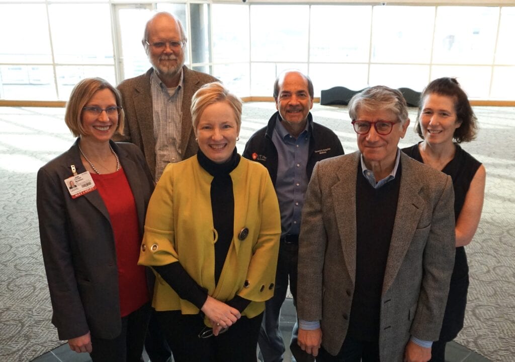 Members of TRI’s External Advisory Board pose for a photo with (front l-r) TRI Executive Director Christi Madden, MPA, and TRI Director Laura James, M.D. The EAB members include (front, right) Julian Solway, M.D., (chair) from the University of Chicago; and (back, l-r) W. Robert Taylor, M.D., Ph.D., Emory University; Joel Tsevat, M.D., MPH, University of Texas Health San Antonio; and Rachel Hess, M.D., M.S., University of Utah. Not pictured: EAB members who attended the meeting remotely are Sergio Aguilar-Gaxiola, M.D., University of California – Davis Health; and Sean D. Mooney, Ph.D., University of Washington. 