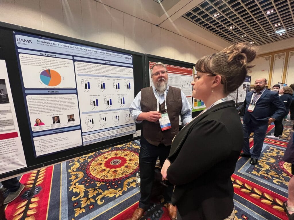 TRI's Paul Duguid, MPH, presents a poster about TRI's Strategies for Training and Advancing underrepresented Researchers (STARS) Program. 