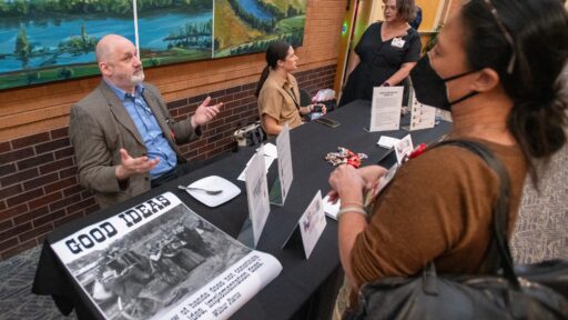 Geoffrey Curran, Ph.D., discusses implementation science opportunities with attendees of the 2024 TRI Research Expo. (Photo by Bryan Clifton)