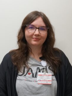 Jaden Jackson, BS, MS Jaden Jackson is a woman with long brown hair and wearing glasses.