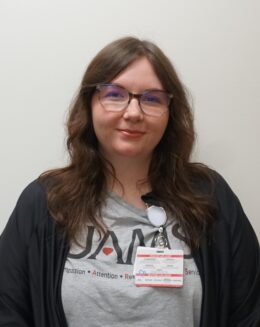Jaden Jackson, BS, MS Jaden Jackson is a woman with long brown hair and wearing glasses.